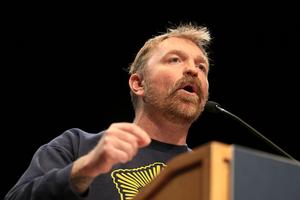 ORONO, MAINE - MAY 24: Democratic U.S. Senate candidate Graham Platner speaks at a “Fighting Oligarchy” tour stop held by Sen. Bernie Sanders (I-VT) at the Collins Center for the Arts on the University of Maine campus on May 24, 2026 in Orono, Maine. Platner is the presumptive Democratic nominee and will face incumbent Sen. Susan Collins (R-ME) for Maine's U.S. Senate seat in the general election.  (Photo by Joe Raedle/Getty Images)