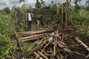 Fred Ngusilo, left, a member of the Ogiek community, works with a relative to sift through the ruins of their grandfather's house in the Mau forest, destroyed by Kenyan police. Tony Karumba/AFP via Getty Images