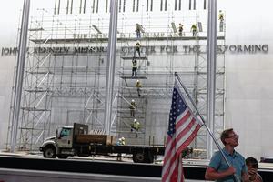 WASHINGTON, DC - JUNE 13: Demonstrators sit outside The Kennedy Center on June 13, 2026 in Washington, DC. Friday marks the court-ordered deadline to remove President Donald Trump's name from the Kennedy Center. (Photo by Tasos Katopodis/Getty Images)