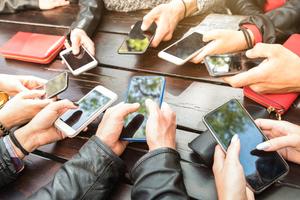 Teens on social media. Dreamstime/TCA