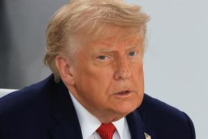 US President Donald Trump reacts during a working lunch meeting of G7 members, partner countries, and artificial intelligence business leaders as part of the G7 summit, in Evian, eastern France, on June 17, 2026. A G7 summit is set to take place June 15 to 17 in the French town of Evian-les-Bains near Switzerland and it will be attended by country leaders as well as the EU's foreign policy chief and ministers from Brazil, Canada, the United Arab Emirates and Turkey. (Photo by Ludovic MARIN / AFP via Getty Images)