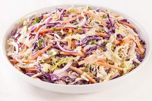 Little adjustments like apple in the slaw and celery seed in the potato salad are familiar tiny twists. Dreamstime/TNS