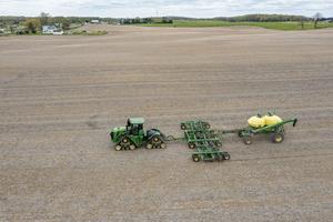 A farmer in Michigan spreads liquid fertilizer on a field. Jim West/UCG/Universal Images Group via Getty Images