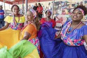 Migrant Haitian women in the U.S. have helped organize and participate in traditional Haitian cultural celebrations in communities like Little Haiti in Miami, where this photo was taken.
              Jeff Greenberg/Universal Images Group via Getty Images