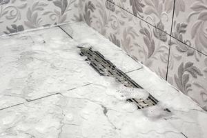Linear drains are often not as efficient as point drains. (Dreamstime/TCA)