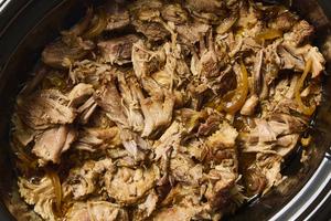 A can of soda and a few flavorful ingredients are all you need for the perfect slow-cooker pulled pork. (Alex Lepe/TCA)