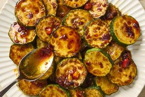 An easy chili crisp sauce makes seared zucchini sing. (Alex Lepe/TCA)