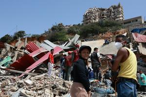 In the days immediately following the earthquakes, neighbors came together to search for survivors. picture alliance/picture alliance via Getty Images