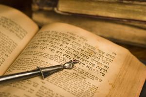 Old Hebrew Bible and pointer. Dreamstime/TCA