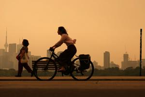 Heavy wildfire smoke from Canada's forests turn skies orange in Toronto and across parts of the U.S. in July 2026. Steve Russell/Toronto Star via Getty Images