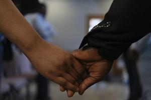 Ushers at the First Haitian Evangelical Church of Springfield, Ohio, hold hands during Sunday service on Jan. 26, 2025. AP Photo/Luis Andres Henao