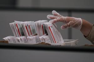 A worker inspects a ballot the day after California's primary election at the Los Angeles County Ballot Processing Center on June 3, 2026. Jae C. Hong/AP Photo