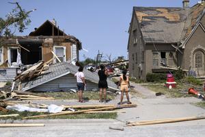 Residents inspect the damage amid debris and destroyed homes a day after a tornado ripped through Menasha, Wisconsin, on Tuesday, July 28, 2026. (Octavio Jones/AFP/Getty Images/TNS)