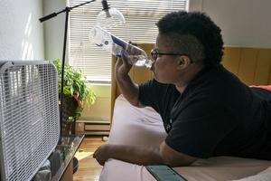 During miserable heat waves, people tend to stay inside if it's cooler there, limiting social connection. AP Photo/Nathan Howard