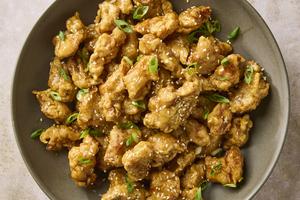 Who needs takeout when you can make extra-crispy double-fried chicken bites coated in a savory-sweet honey sauce right at home in under an hour? (Alex Lepe/TCA)