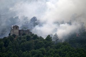 Fires burned across Spain in summer 2026. Acting quickly to shore up old stone walls when buildings burn can help preserve a region's history. Jose Jordan/AFP via Getty Images