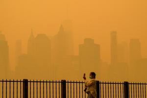 Wildfire smoke from Canadian fires has turned New York City's sky a hazy orange several times in recent years.  Angela Weiss/AFP via Getty Images