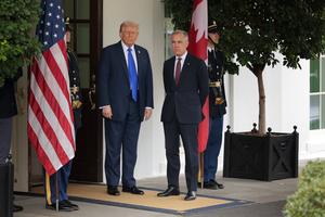 U.S. President Donald Trump welcomes Canadian Prime Minister Mark Carney to the White House on Oct. 7, 2025 in Washington, D.C. Last year, North American leaders had yet to find common ground on tariffs for several key Canadian exports, including automobiles, steel, aluminum, and softwood lumber. (Chip Somodevilla/Getty Images/TCA)