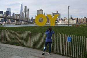 A sculpture by Deboray Kass that says 'Yo' from one side and the popular Yiddish expression 'Oy' from the other stood on display in Brooklyn Bridge Park in New York in 2015.  AP Photo/Kathy Willens