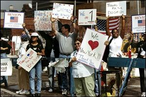 People cheer rescue workers on their way to the site of the 9/11 terror attacks in New York. After major disasters, people often extend help beyond their social circles, crossing political, socioeconomic and religious divides. Peter Turnley/Archive Photos via Getty Images