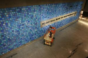 'No Day Shall Erase You From the Memory of Time,' a phrase written by the Roman poet Virgil, is displayed on a wall at the 9/11 Memorial Museum.   Spencer Platt/Getty Images
