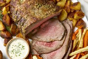 Make a traditional Sunday roast with rosemary roasted beef, carrots and parsnips, crispy potatoes, creamy horseradish sauce, and warm gravy. (Alex Lepe/TCA)