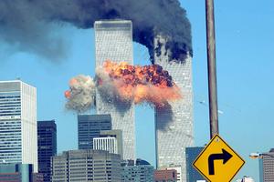 394261 14: A fiery blasts rocks the World Trade Center after being hit by two planes Sept. 11, 2001 in New York City. (Photo by Spencer Platt/Getty Images)