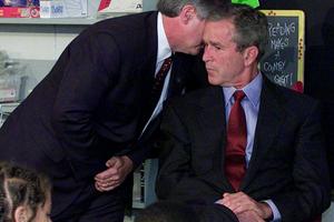 President George W. Bush reacts in a Sarasota, Fla., classroom after being told of the terrorist attacks in New York and Washington on Sept. 11, 2001. AP Photo/Doug Mills