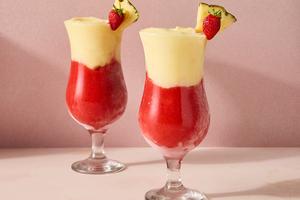 This frozen cocktail layers creamy coconut and pineapple with sweet strawberry for a refreshing, frosty drink. (Erik Bernstein/TCA) FILENAME:
