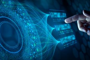 Big data analysis with AI technology. Person using machine learning and deep learning neural network for data science, data mining, business analytics, automation, data engineering. Dreamstime/TCA