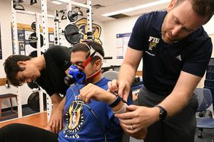 Study participants rode a recumbent bike while wearing four smartwatches and breathing into a metabolic analyzer. Taimy Alvarez/Florida International University