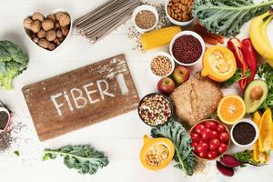 Many whole foods, such as fruits, vegetables, legumes and nuts, are high in fiber. bit245/iStock via Getty Images Plus