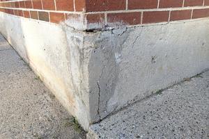 The person who tried to patch this concrete foundation either didn't care or didn't bother to research how to achieve professional results. (Tim Carter/Tribune Content Agency/TNS)
