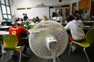 Many older school buildings lack air conditioning, leaving fans as the main defense against classroom heat. RJ Sangosti/MediaNews Group/The Denver Post via Getty Images