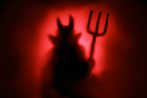 Creepy Devil silhouette from hell in the mist with backlit. Dreamstime/TCA