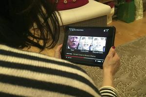 A woman views a manipulated video in January 2019 that changes what is said by President Donald Trump and former President Barack Obama, illustrating how deepfake technology can deceive viewers. Robe LeverAFP via Getty Images