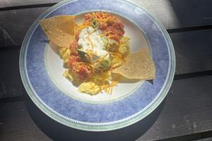 Crispy tortilla chips, salsa and fluffy eggs come together in this satisfying breakfast. (Diane Rossen Worthington/TCA)