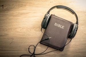 Bible with headphones. Dreamstime/TCA