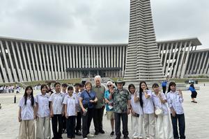 Schoolchildren in Hanoi greet our group at the War Museum. Andy Yemma