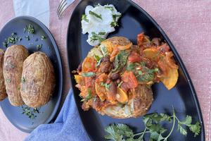 Crispy jacket potatoes make a hearty meal for cool fall evenings. (JeanMarie Brownson/TCA)