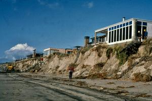 Storm waves eroded the dunes from beneath homes in Pajaro Dunes, Calif., on Monterey Bay, during the powerful 1982-83 El Nino. Gary Griggs