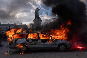 PARIS, FRANCE - OCTOBER 17: A car is set ablaze during demonstrations on October 17, 2026 in Paris, France. The involvement of the Gilets Jaunes (Yellow Vests) with the ongoing French school blockades expands the scope of these demonstrations by linking localised student grievances to broader economic policies. Student unions originally initiated the movement to protest underfunding, deteriorating infrastructure, and acute teacher shortages across French high schools and universities. By joining the protests, the Gilets Jaunes introduce their established platform against austerity cuts, rising living costs, and surging fuel prices into the youth-led action. (Photo by Carl Court/Getty Images)
