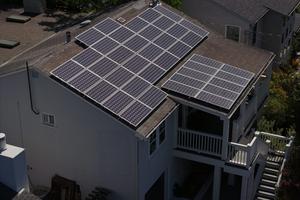 Solar panels have become far cheaper than physicist Amory Lovins anticipated, letting him and others generate electricity affordably on their own rooftops. Justin Sullivan/Getty Images