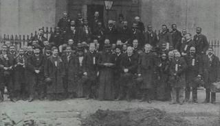 Attendees at the 1892 Colored Catholic Congress included the nation's first openly Black priest, Augustus Tolton, who stands in the middle of the front row. Wikimedia Commons