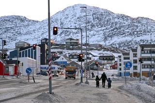 People walk along a street in Nuuk, the capital of Greenland. Ina Fassbender/AFP via Getty Images