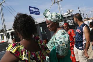 A group of refugees and asylum-seekers tour a commercial fishing marina as part of a summer immersion program in August 2018 in Eastport, Maine.  John Moore/Getty Images