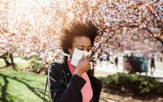 Windy days can mean more pollen and more sneezing. mladenbalinovac/E+ via Getty Images
