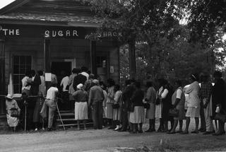 A group of voters lining up on May 3, 1966, outside the polling station in Peachtree, Ala., after the Voting Rights Act was passed the previous year.  MPI/Getty Images